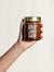 Vallentine & Co Guaraná Latte single jar held against a light backdrop