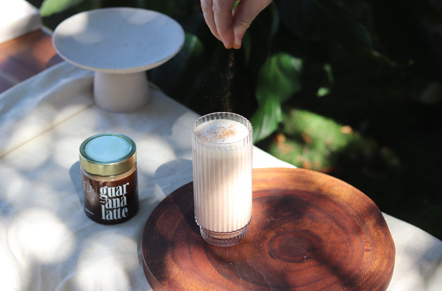 Finished Vallentine & Co Guaraná Latte with cinnamon garnishshop_this_look_EcLGgQ