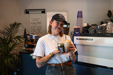Woman enjoying Vallentine & Co Guaraná Latte coffee alternative